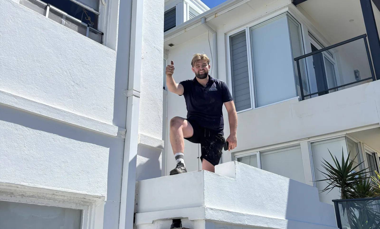 Plumber at a balcony drain call-out